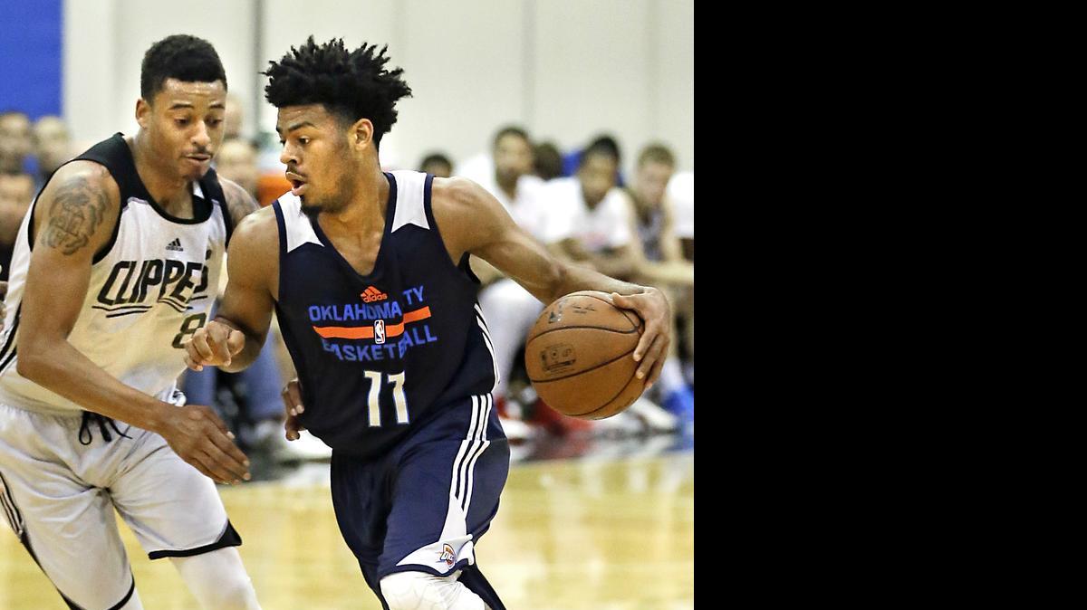 
Oklahoma City Thunder's Quinn Cook (11) drives past Los Angeles Clippers' Diante Garrett during the first half of an NBA summer league basketball game, Tuesday, July 7, 2015, in Orlando, Fla. 
