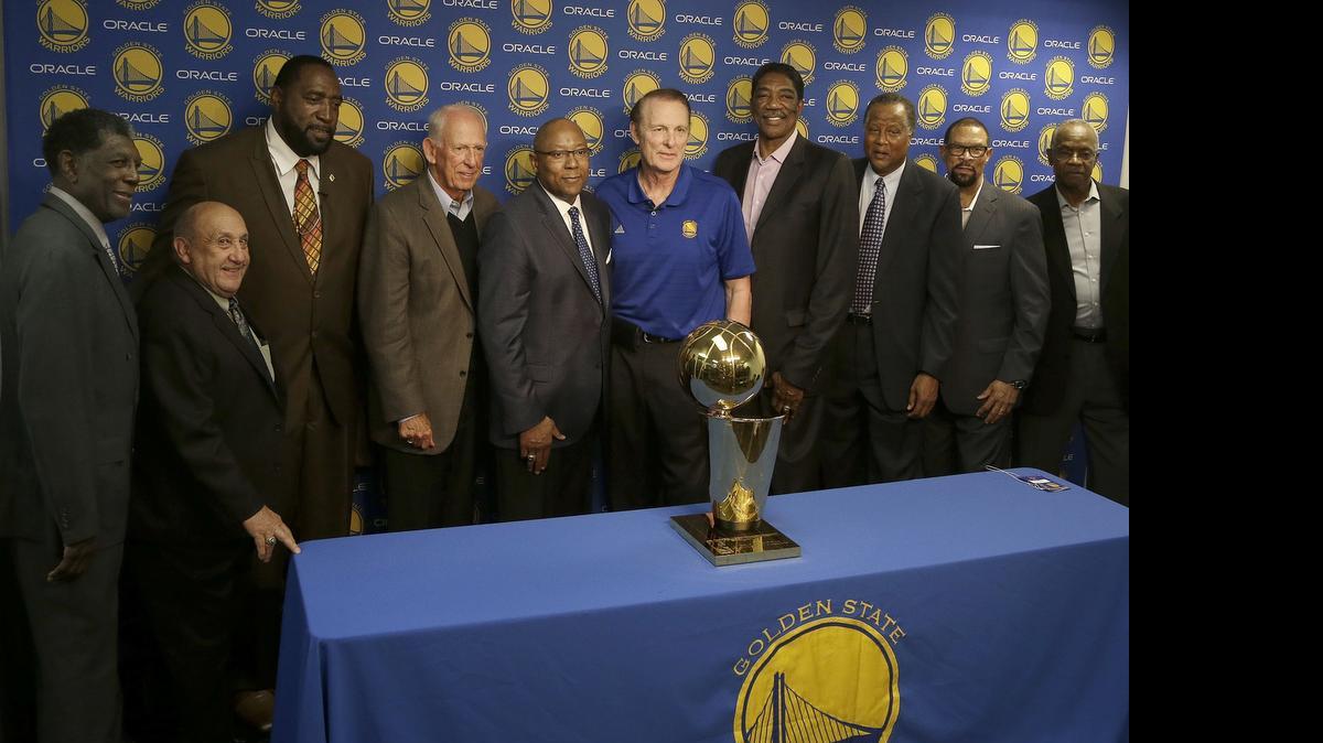
Members of 1975 Golden State Warriors, who had a reunion in March, include (far left) former coach Al Attles, and (fourth from left) Jeff Mullins and Rick Barry (center).


