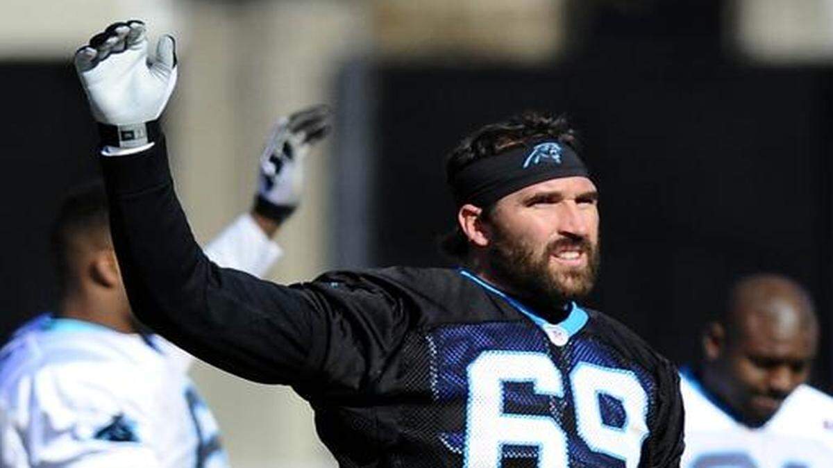 Carolina Panthers defensive end Jared Allen (69) stretches before practice on Thursday. Allen has a broken bone in his right foot but might play in Sunday’s NFC Championship game against the Arizona Cardinals.