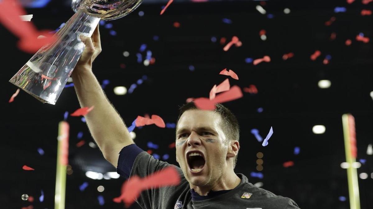 New England Patriots quarterback Tom Brady hoists the Vince Lombardi Trophy after Sunday’s 34-28 overtime win against the Atlanta Falcons in Super Bowl 51.