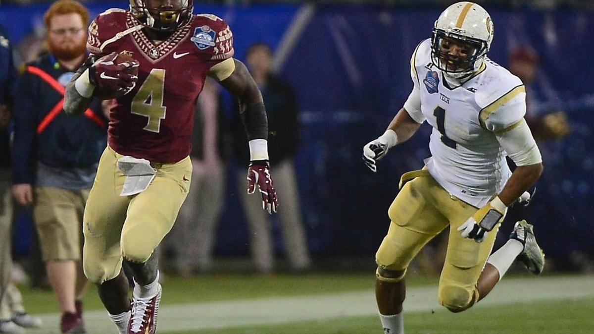Florida State's Dalvin Cook (4) runs for a first down as he is chased by Tyler Hunter (1) during the first quarter of the ACC Championship at Bank of America Stadium Saturday, Dec. 6, 2014.