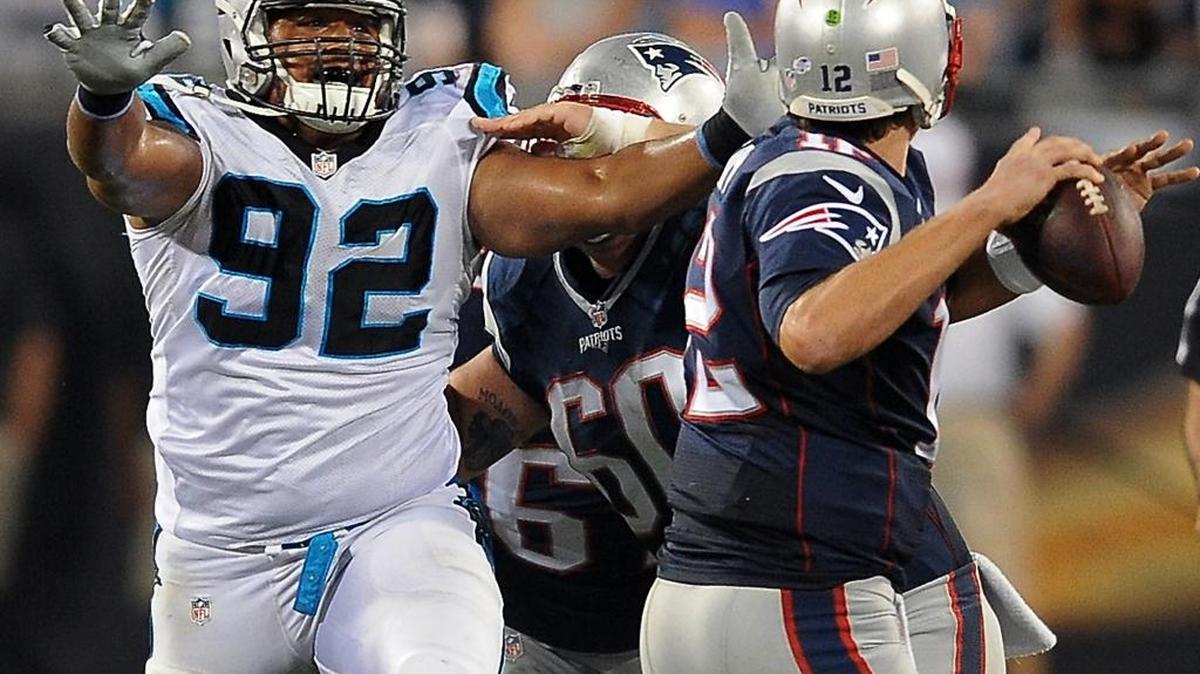 
Carolina Panthers defensive tackle Dwan Edwards rushes New England Patriots quarterback Tom Brady  at Bank of America Stadium in Charlotte.
