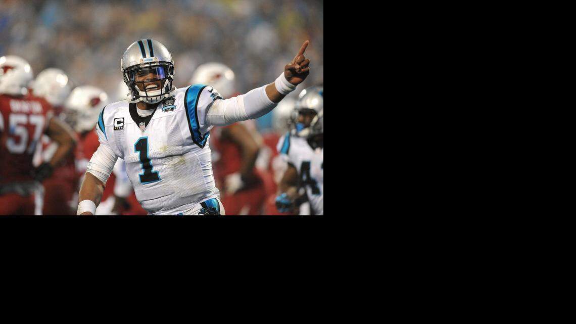 
Carolina Panthers quarterback Cam Newton (1) celebrates a touchdown run by running back Fozzy Whittaker against the Arizona Cardinals, Jan. 3, 2015 in Charlotte. 
