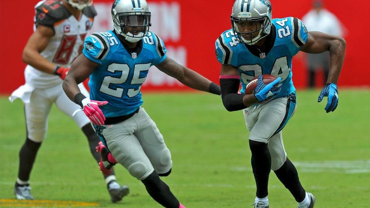 
Panthers cornerback Josh Norman, right, intercepts a pass by Tampa Bay quarterback Jameis Winston for a touchdown during first quarter action on Sundayat Raymond James Stadium in Tampa, Fla. In center is teammate and cornerback Bene Benwikere. 
