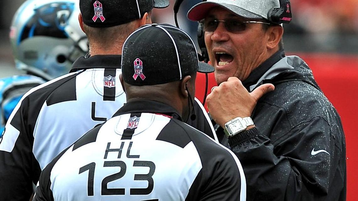 
Carolina Panthers head coach Ron Rivera, right, talks with officials along the sideline during first quarter action vs the Tampa Bay Buccaneers on October 4, 2015 at Raymond James Stadium in Tampa, Fl. The Panthers defeated the Buccaneers 37-23.
