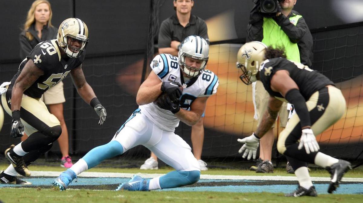 
Carolina Panthers tight end Greg Olsen (88) secures the ball for a touchdown past New Orleans Saints linebacker Stephone Anthony (50) and Hau'oli Kikaha (44) in the second quarter at Bank of America Stadium on Sunday.
