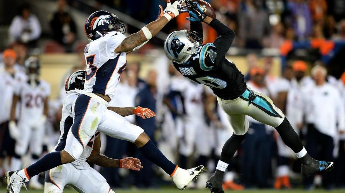 Carolina Panthers wide receiver Philly Brown, right, makes a leaping catch of a pass from quarterback Cam Newton as Denver Broncos safety T.J. Ward applies defensive pressure during the third quarter of Super Bowl 50 at Levi's Stadium in Santa Clara, Calif.