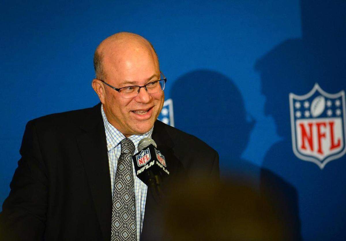 Hedge fund manager David Tepper, whose purchase of the Carolina Panthers was finalized on Monday, laughs as he answers a reporter’s question during his introductory press conference at the Whitley Hotel in Atlanta on May 22, after NFL owners approved him as owner.