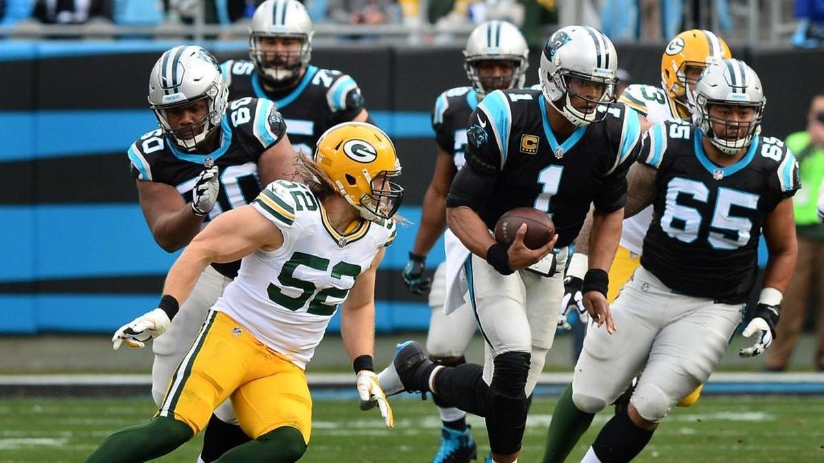 Carolina Panthers quarterback Cam Newton rushes for a first down against the Green Bay Packers during the first quarter on Sunday, Dec. 17, 2017 at Bank of America Stadium. The Panthers won, 31-24.