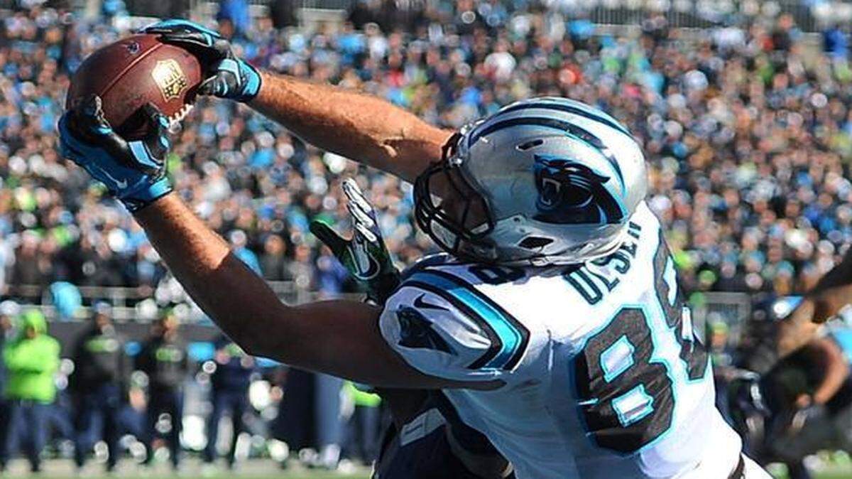 Carolina Panthers tight end Greg Olsen catches a touchdown pass from quarterback Cam Newton during second quarter, giving the Panthers a 31-24 victory over the Seattle Seahawks. He had several key catches in the second half as well.