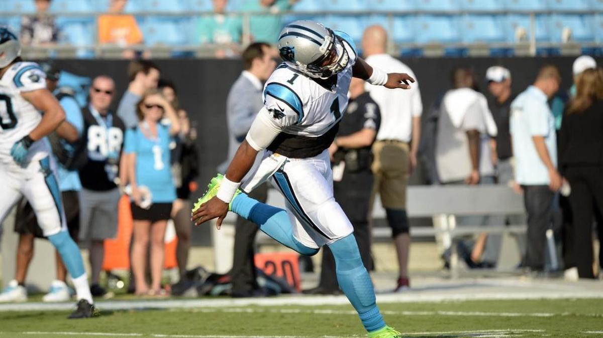 
Carolina Panthers quarterback Cam Newton (1) runs onto the field prior to the start of the preseason game against the Miami Dolphins at Bank of America Stadium on Saturday, Aug. 22, 2015.

