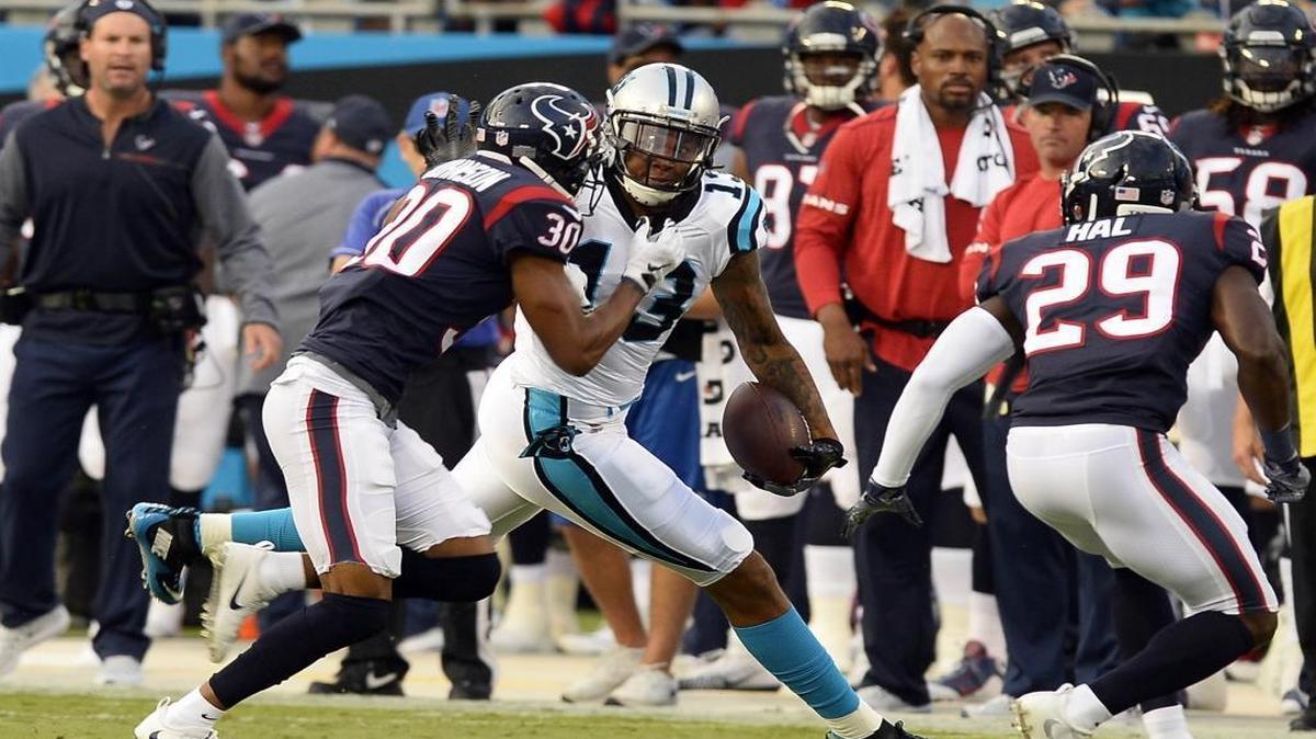 Panthers receiver Kelvin Benjamin (13) shakes off Houston cornerback Kevin Johnson and safety Andre Hal (29) for a big gain Wednesday. Benjamin later scored on a 23-yard touchdown catch.