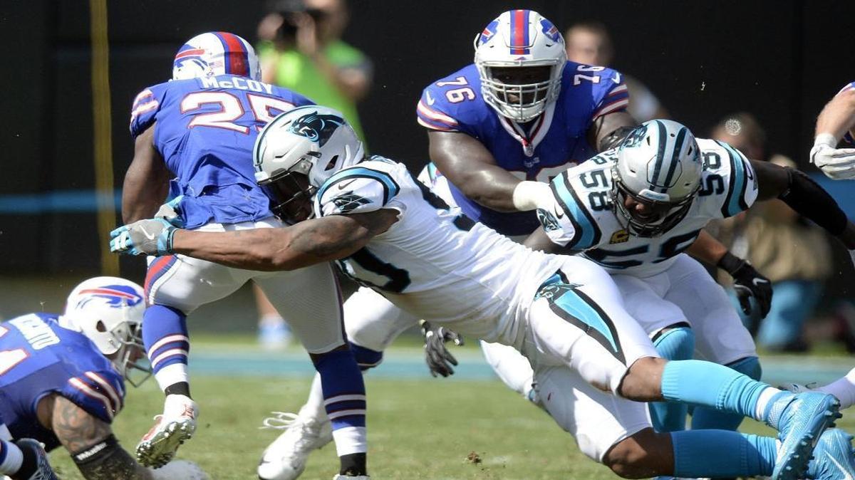 The Carolina Panthers held the Buffalo Bills to 69 yards rushing, limiting top back LeSean McCoy to just 9 rushing yards, in Sunday’s 9-3 victory. Above, Carolina Panthers defensive end Julius Peppers (90) brings down McCoy (25) in the second half.