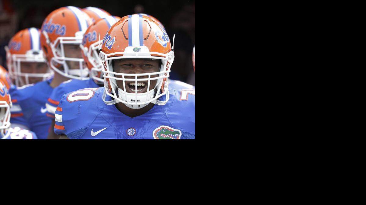 
Florida offensive linesman D.J. Humphries (front) prepares to take the field with teammates against Eastern Michigan in September. Several NFL mock drafts have the Panthers picking Humphries in the draft.
