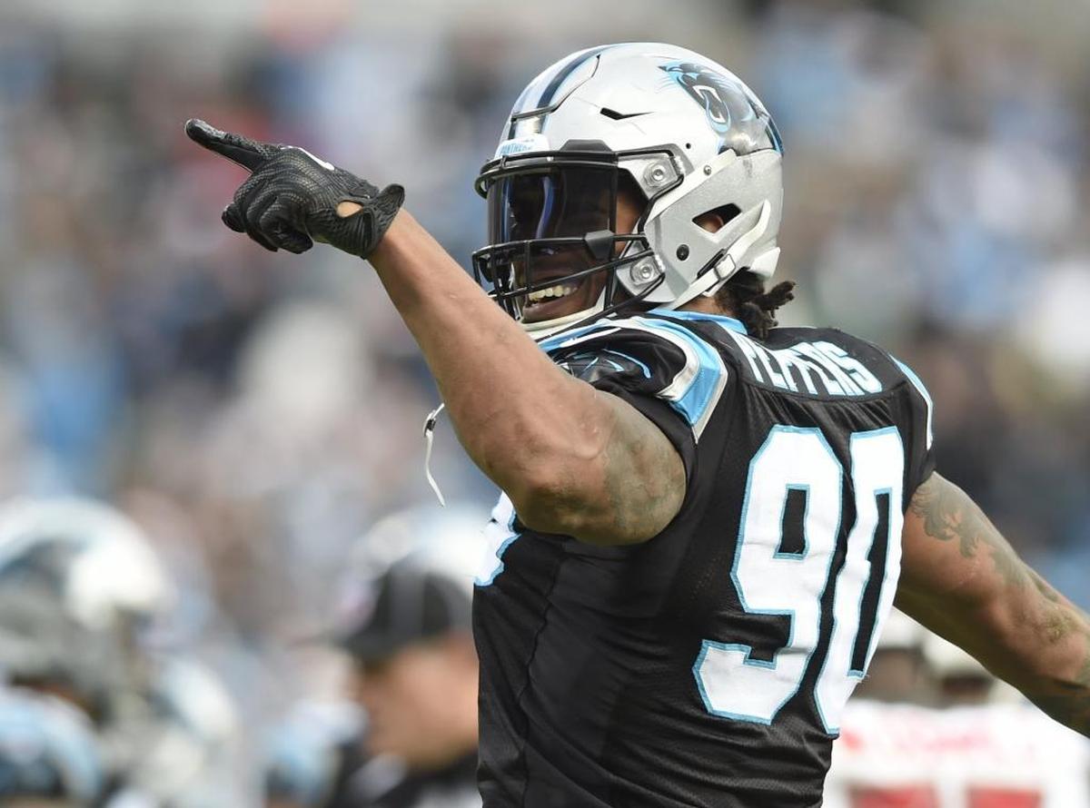 Carolina Panthers defensive end Julius Peppers (90) celebrates during a game in which he had two fumble recoveries and a sack.