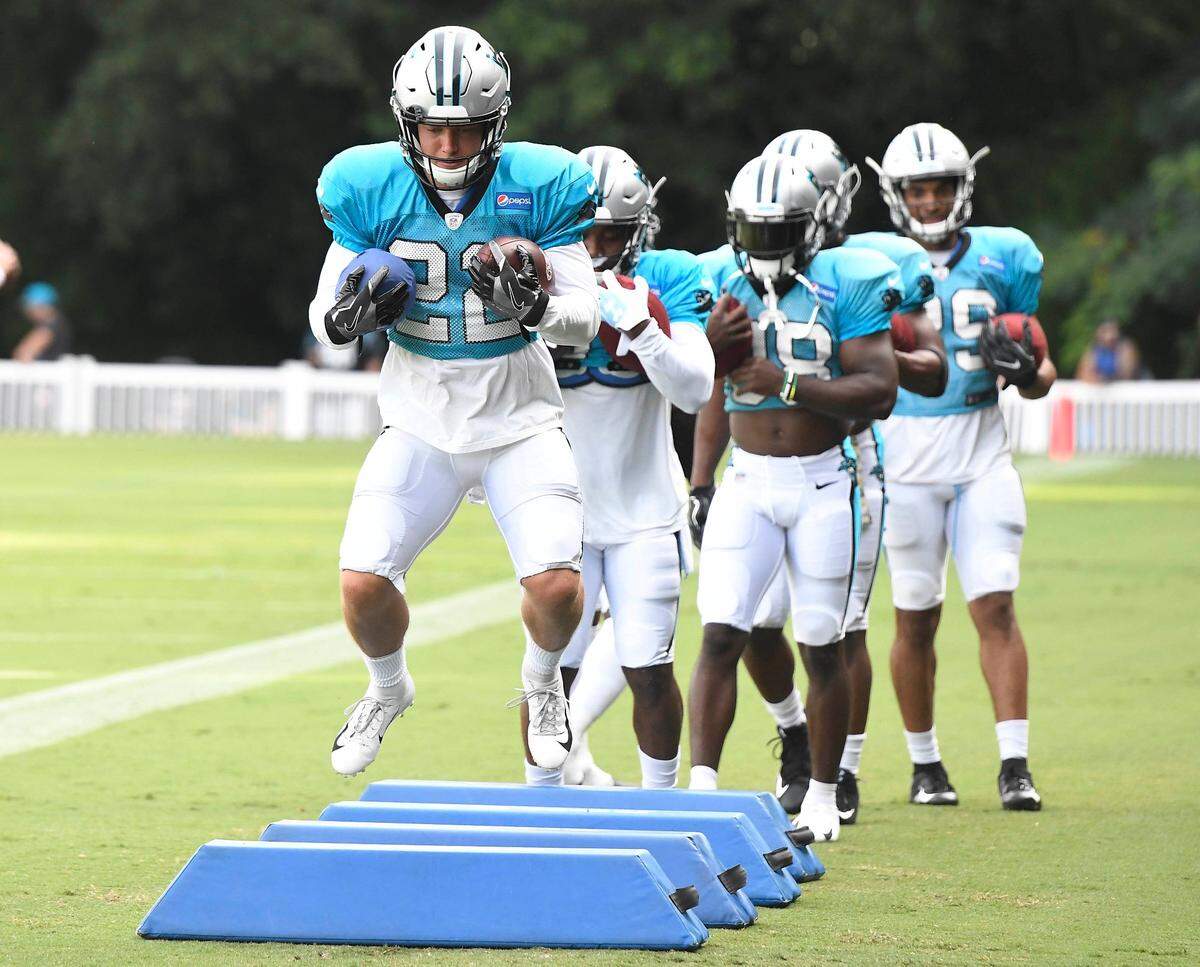 Carolina Panthers running back Christian McCaffrey (22) leads the running backs through a drill during practice at training camp at Wofford College in Spartanburg, SC on Sunday, July 29, 2018.