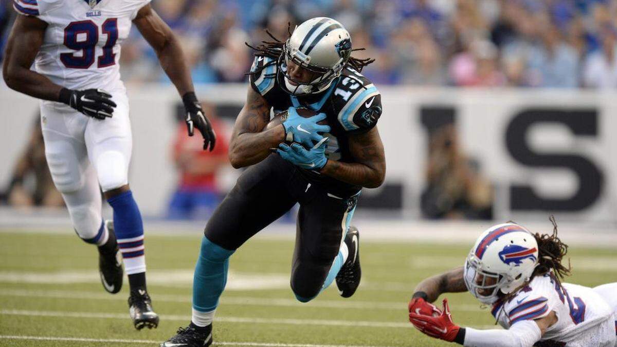 
Carolina Panthers' Kelvin Benjamin (13) makes a reception past Buffalo Bills' Stephon Gilmore (24) in the first half of their preseason game at Ralph Wilson Stadium on Friday, August 14, 2015. The Bills led, 14-10 at halftime.
