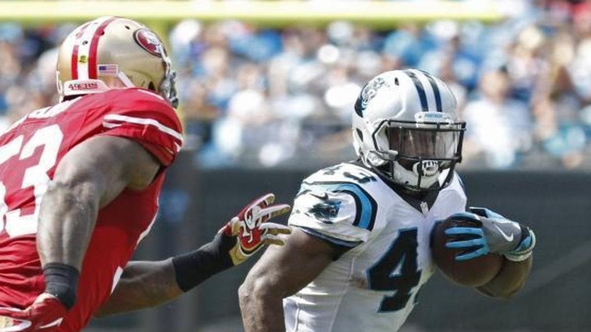 Carolina Panthers' Fozzy Whittaker (43) runs past San Francisco 49ers' NaVorro Bowman (53) and Eli Harold (58) in the second half of an NFL football game in Charlotte, N.C., Sunday, Sept. 18, 2016. (AP Photo/Bob Leverone)