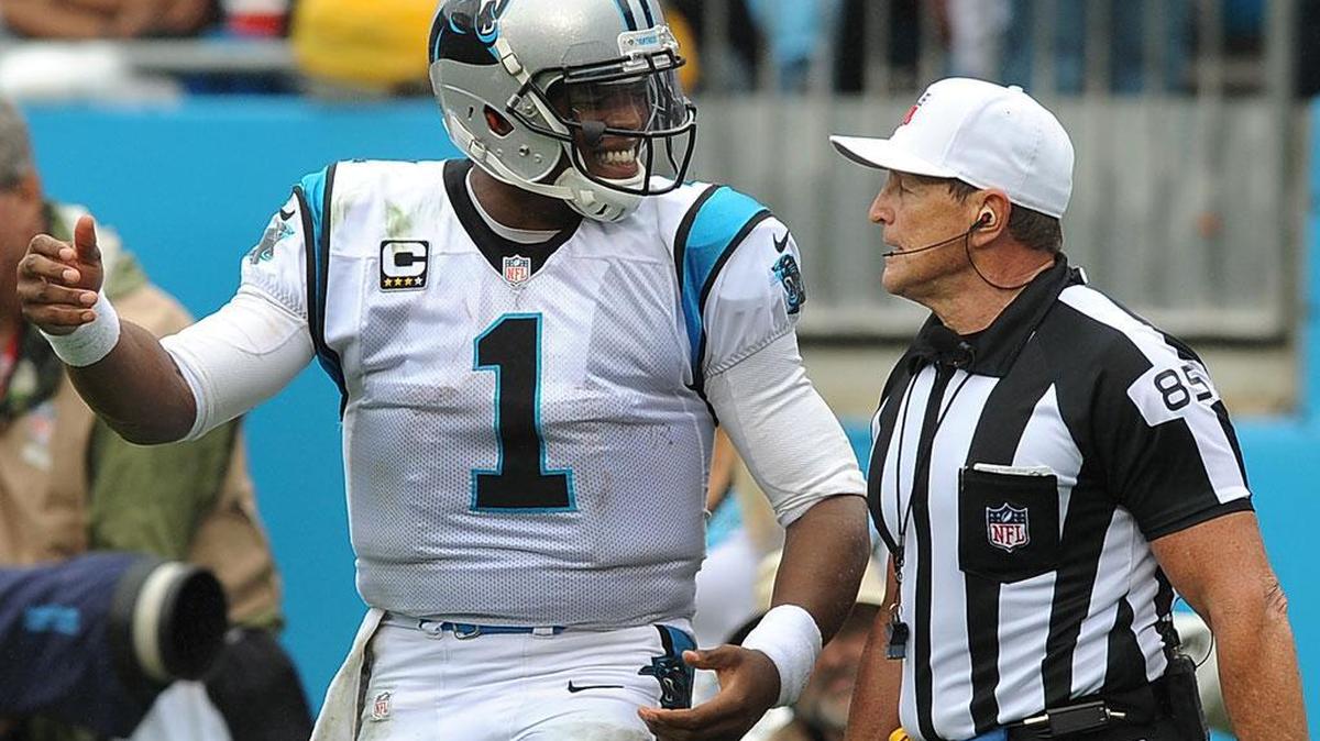 
Carolina Panthers quarterback Cam Newton talks to referee Ed Hochuli after a no-call on a hit  by New Orleans Saints defensive tackle Tyeler Davison during fourth-quarter action on Sunday at Bank of America Stadium in Charlotte. The Panthers defeated the Saints 27-22.
