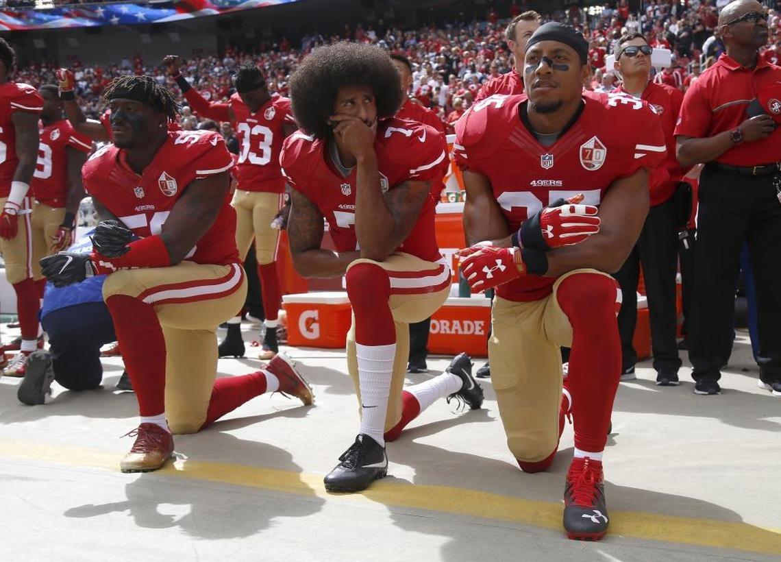 From left, San Francisco 49ers Eli Harold (58), quarterback Colin Kaepernick (7) and Eric Reid (35) kneel during the national anthem before an Oct. 2, 2016 game against the Dallas Cowboys.