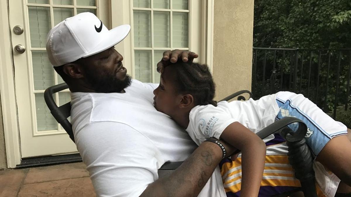 Carolina Panthers defensive end Charles Johnson and his girfriend, Ebony Johnson, are intent on helping their son, Prince, experience a little bit of everything.