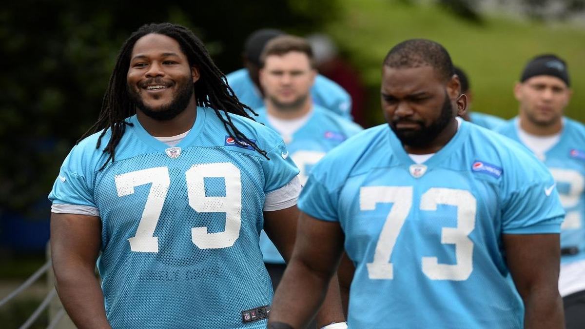 Carolina Panthers guard Chris Scott, left, hadn’t spoken to the media for three years before Wednesday.