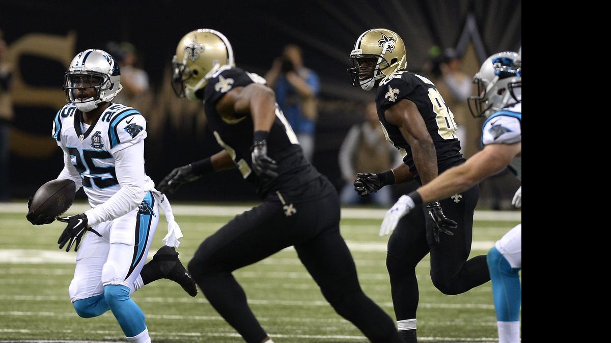 
Carolina Panthers cornerback Bene Benwikere (25) intercepts a pass by New Orleans Saints quarterback Drew Brees on December 7, 2014.
