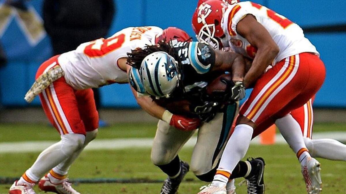 Carolina Panthers wide receiver Kelvin Benjamin is stripped of the ball by Kansas City cornerback Marcus Peters, right, in the final minute of Sunday’s 20-17 loss to the Chiefs.