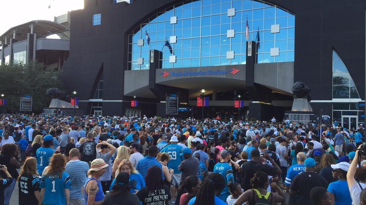 
Fans wait outside of Bank of America Stadium before Friday night’s free Fan Fest.
