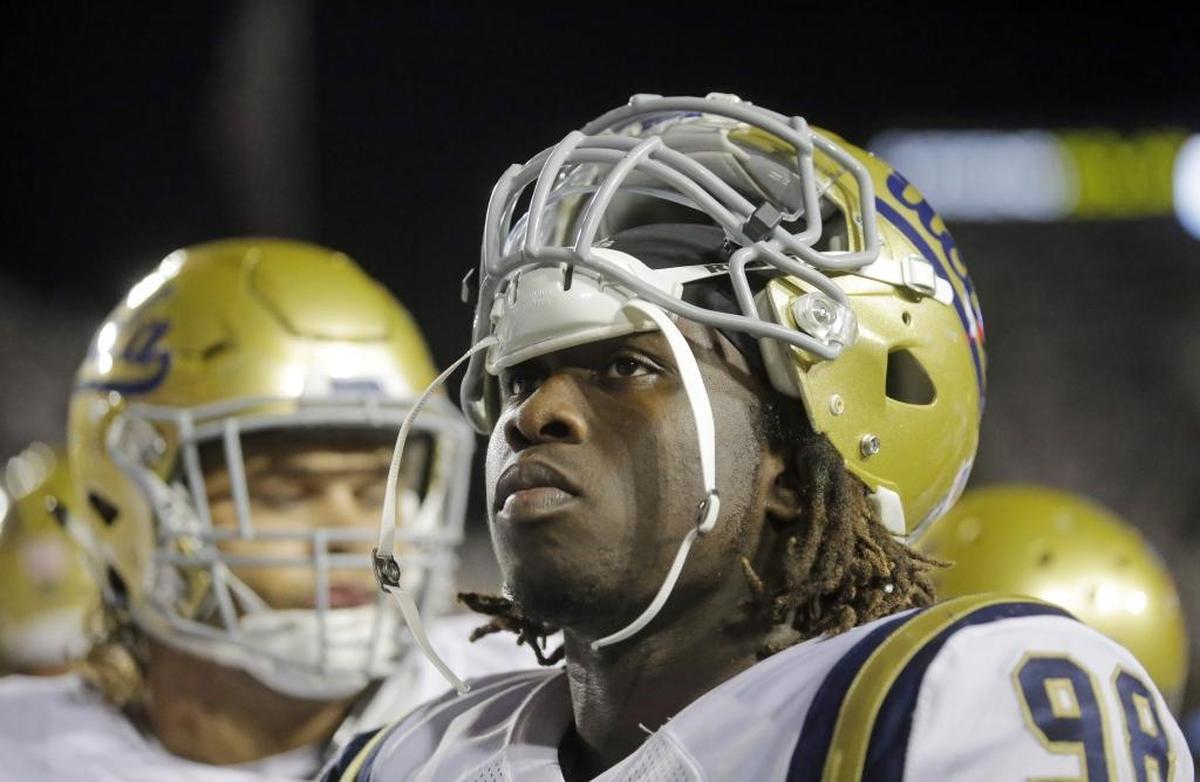 UCLA’sTakk McKinley, right, has the perfect combination of size and speed the Ravens need badly for an outside linebacker/edge rusher hybrid.