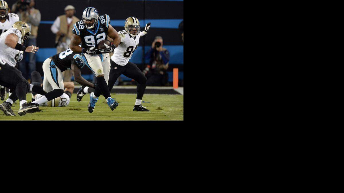 
Carolina Panthers defensive tackle Dwan Edwards (92) heads upheld after intercepting a New Orleans Saints pass in the first quarter at Bank of America Stadium on October 30, 2014. The team signed him to a two-year deal on Tuesday, just before he was scheduled to become a free agent.
