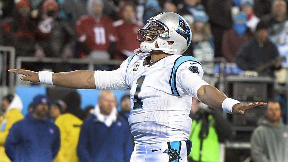 Cam Newton celebrates his touchdown late in the second quarter of Sunday’s NFC Championship game against the Arizona Cardinals.