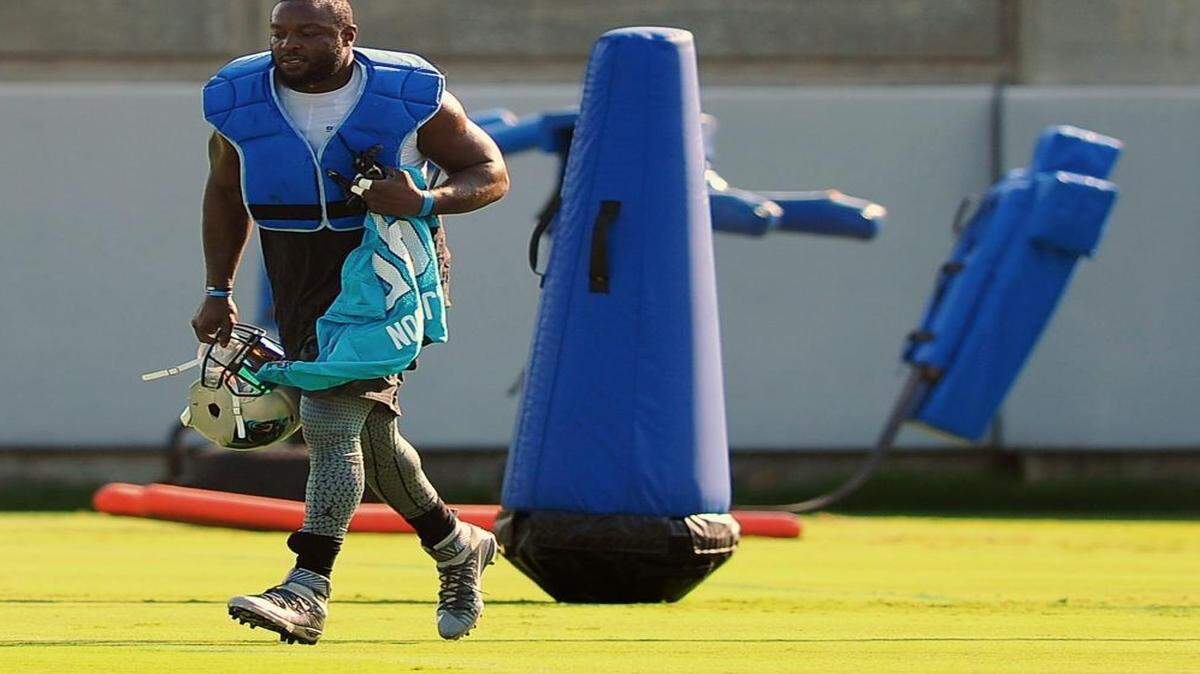 
Carolina Panthers defensive end Charles Johnson jogs across a field to join his teammates during practice on Wednesday. Johnson said he feels like he needs some snaps in the preseason to be ready for opener at Jacksonville. 
