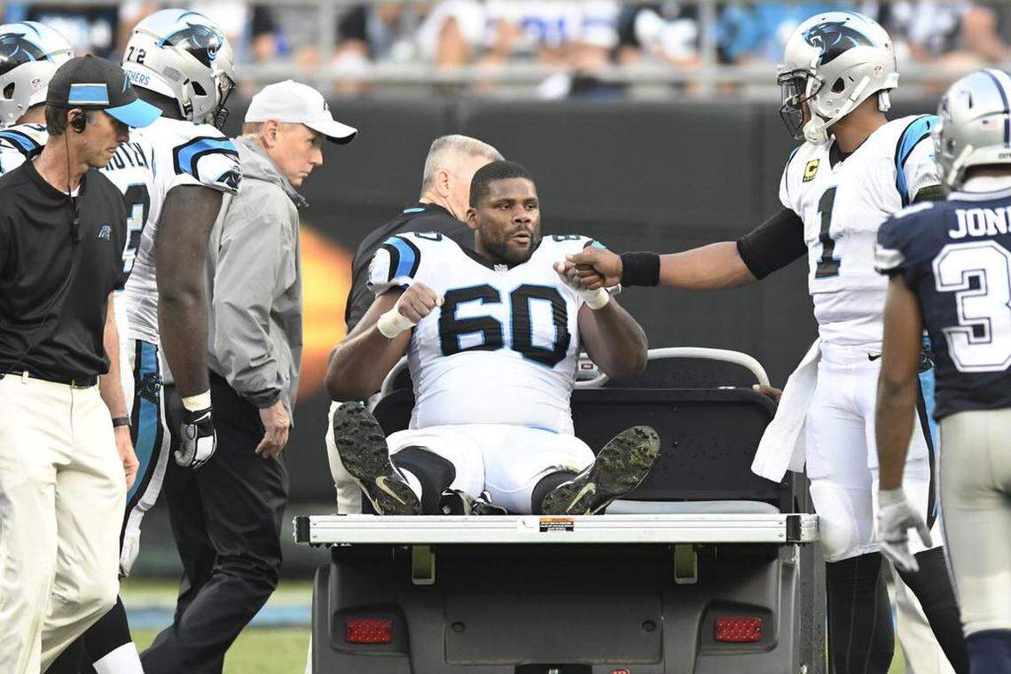 Carolina Panthers offensive tackle Daryl Williams (60) is consoled by Carolina Panthers quarterback Cam Newton (1) as he is prepared to be carted off the field during Sunday’s game against the Dallas Cowboys. Williams was placed on injured reserve on Tuesday morning.