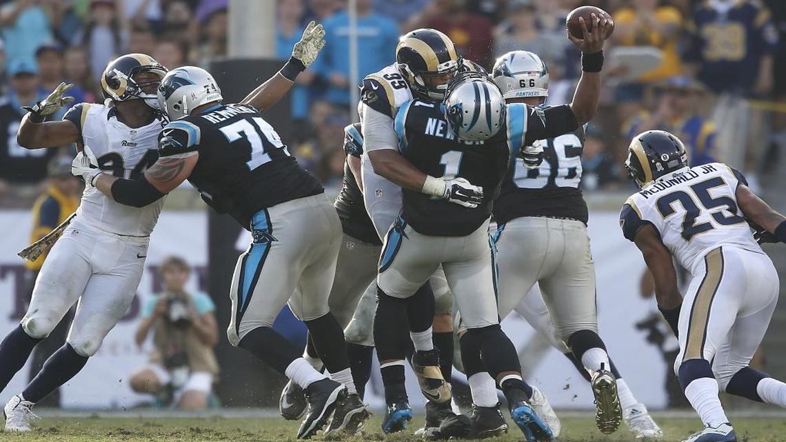 Los Angeles Rams defensive lineman Aaron Donald sacks Carolina Panthers quarterback Cam Newton early in the fourth quarter on Sunday.