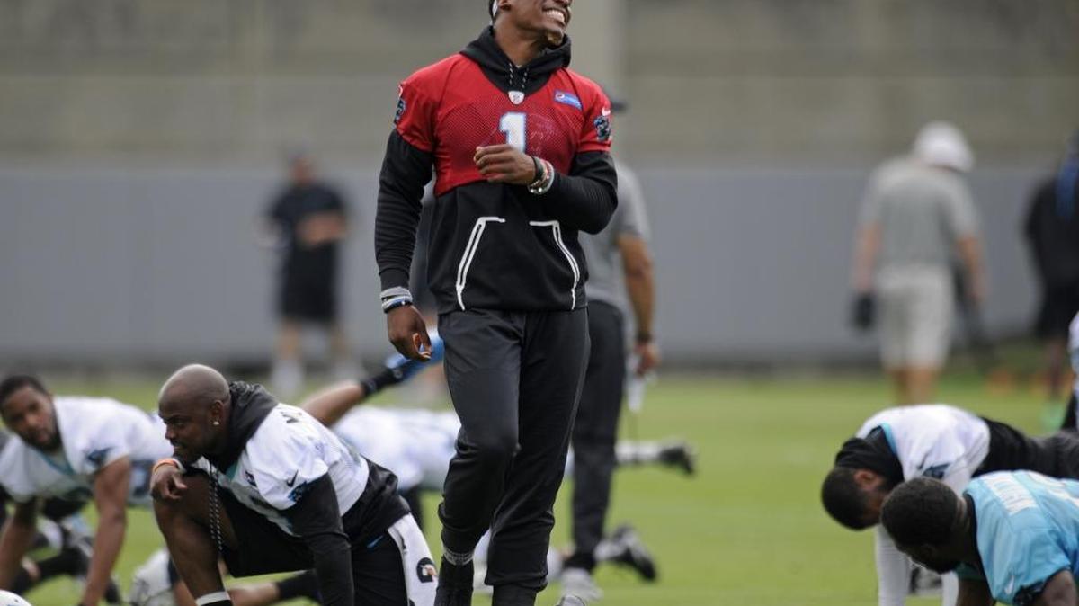 Carolina Panthers quarterback Cam Newton (1) has some fun during practice on the last day of mini-camp on Thursday. Newton did not throw.