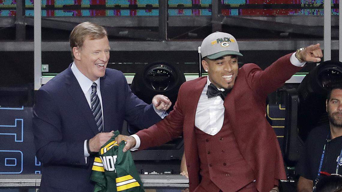 Commissioner Roger Goodell, left, watches as Louisville's Jaire Alexander celebrates after being selected by the Green Bay Packers during the first round of the NFL football draft, Thursday, April 26, 2018, in Arlington, Texas. (AP Photo/Eric Gay)