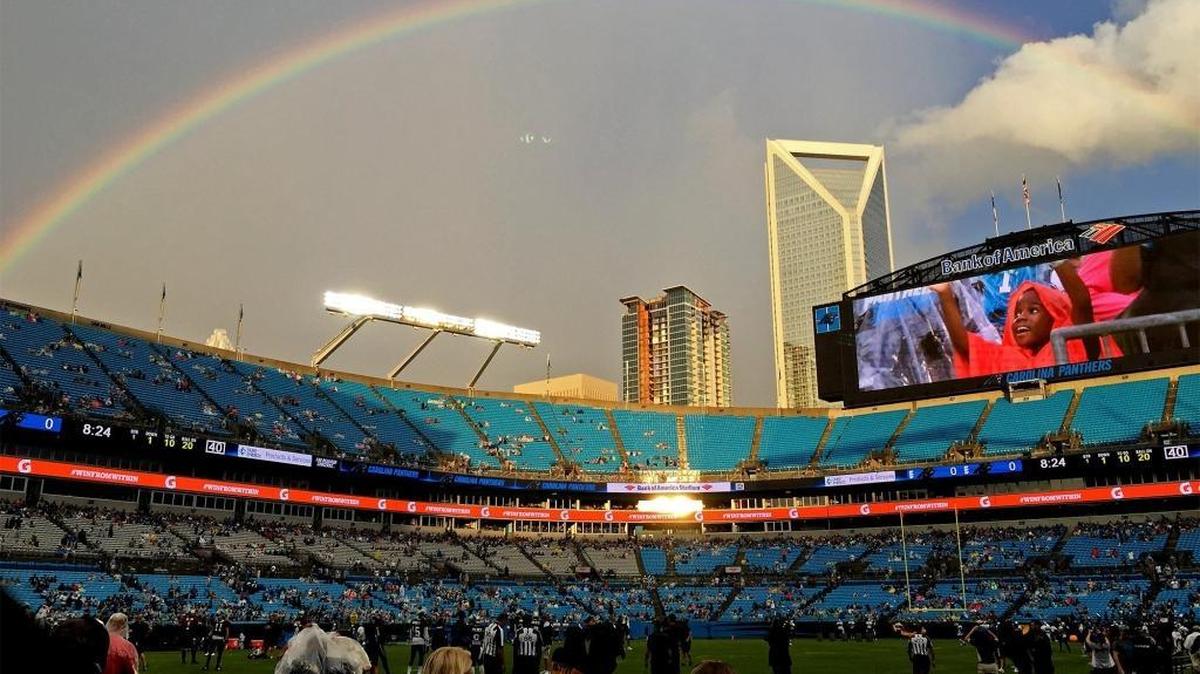 A a rainbow extends over Bank of America Stadium during the Carolina Panthers Fan Fest on Friday in Charlotte.