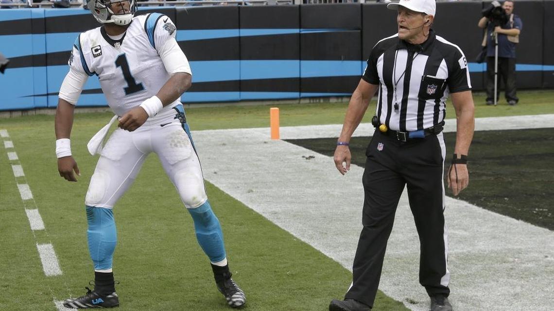 
Carolina Panthers quarterback Cam Newton (1) complains about not getting a late hit call against the New Orleans Saints to NFL referee Ed Hochuli on Sunday.
