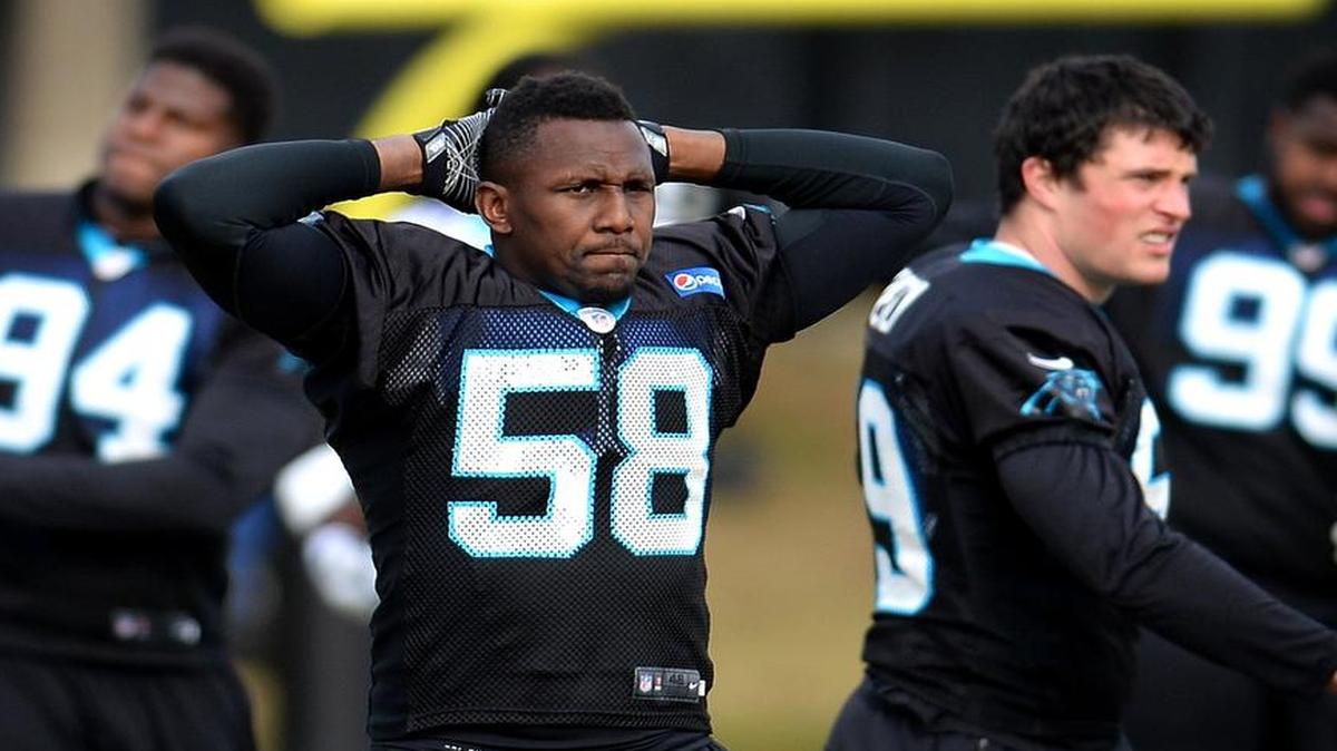 Carolina Panthers linebacker Thomas Davis (center) told reporters Thursday that he has no plans to retire after this season.
