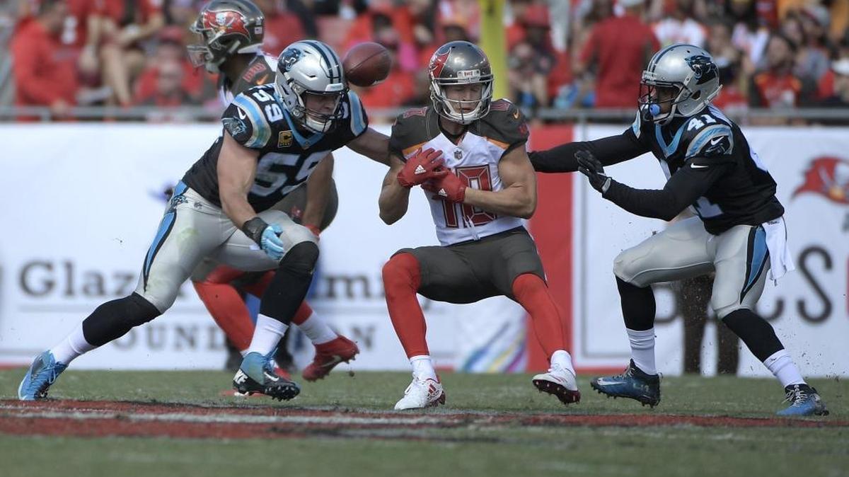 Carolina Panthers middle linebacker Luke Kuechly (59) and defensive back Captain Munnerlyn (41) break up a pass intended for Tampa Bay Buccaneers wide receiver Adam Humphries (10) on Oct. 29 in Tampa, Fla. Munnerlyn has never let his diminuitive size slow him on the football field.