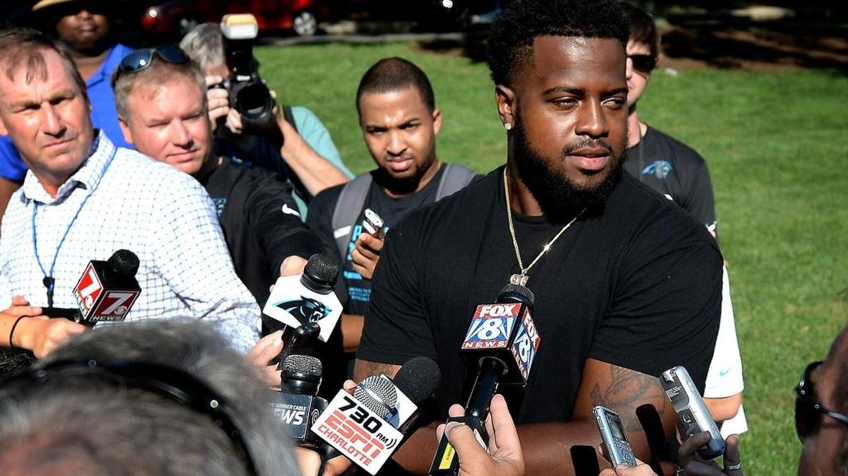 Carolina Panthers defensive tackle Kawann Short, right, answers questions from the media in Spartanburg last month.