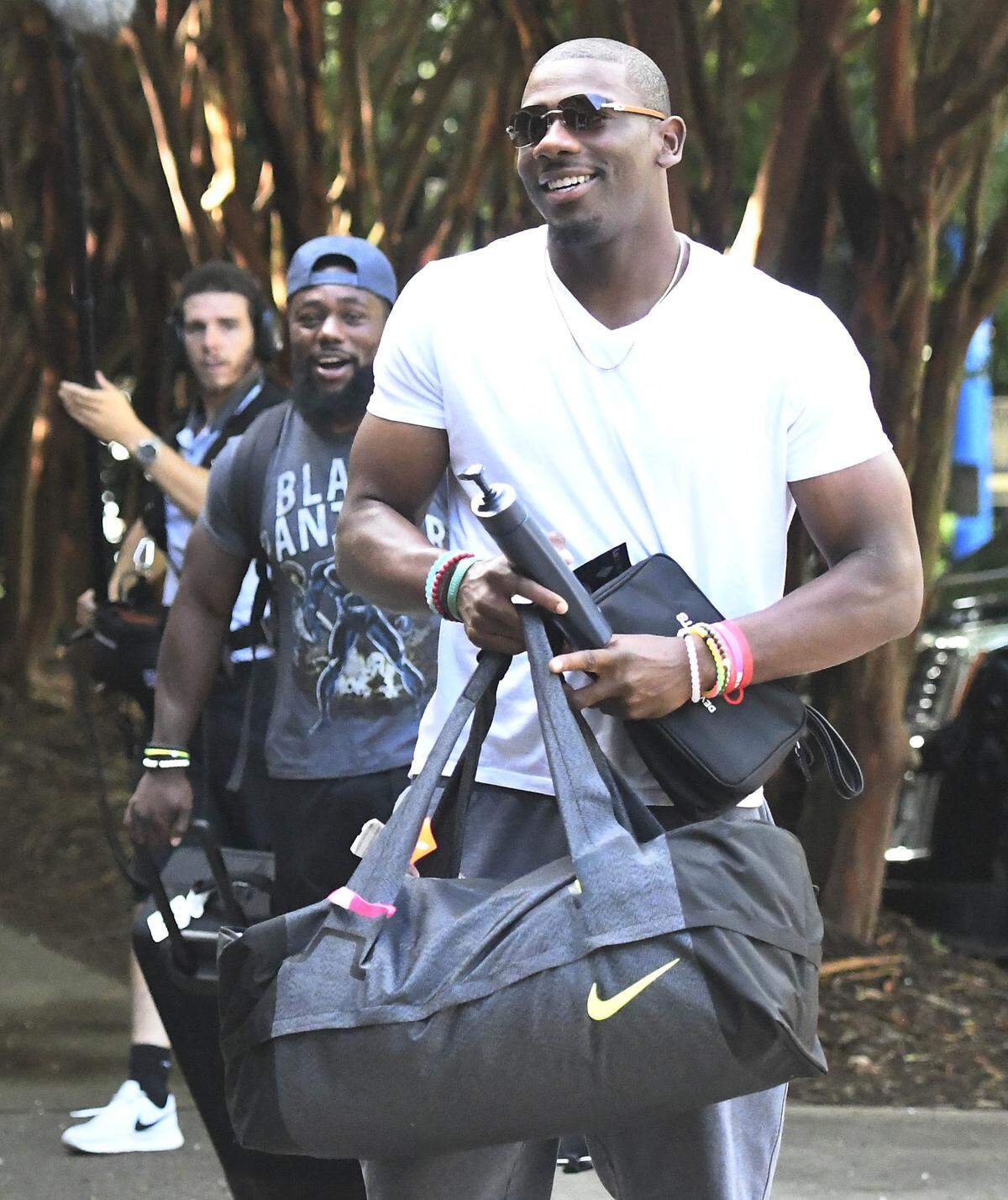 Carolina Panthers wide receiver Devin Funchess (17) smiles as he and running back Kenjon Barner (38) arrive to the dorm for training camp at Wofford College on Wednesday, July 25, 2018.