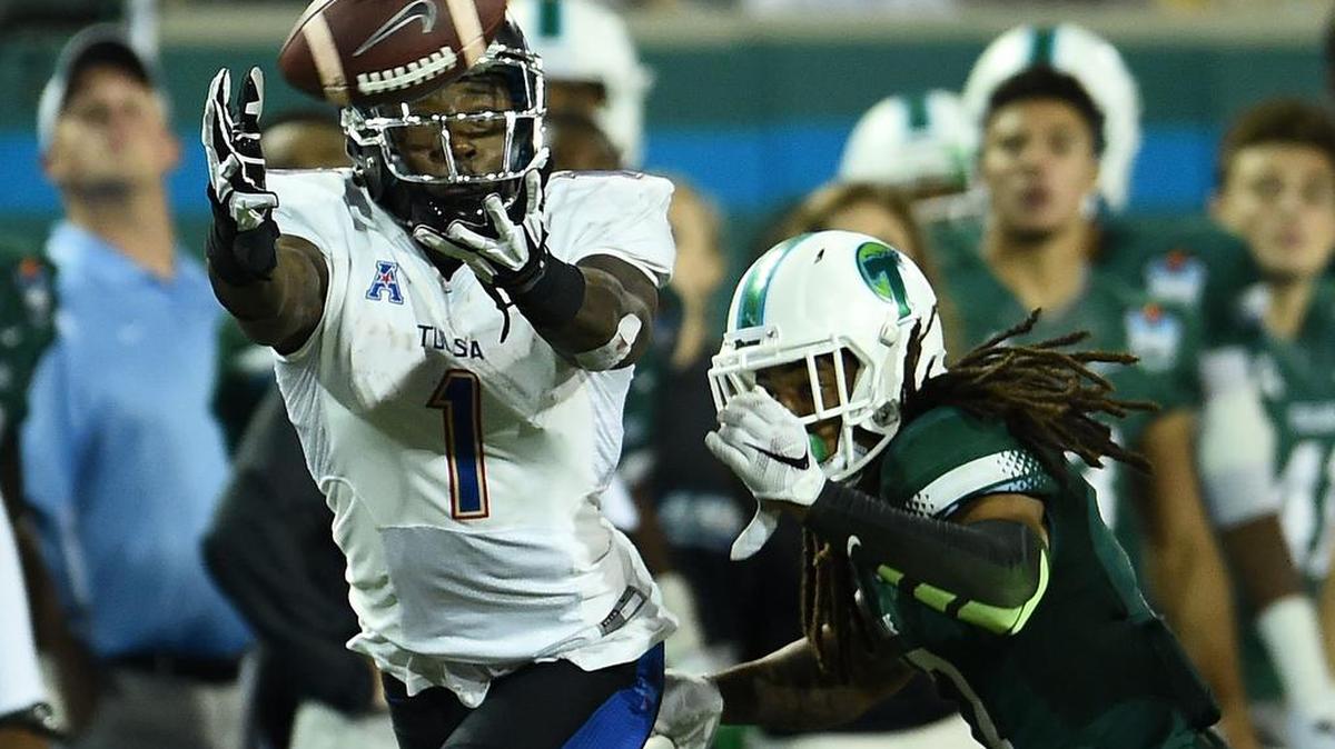 Former Tulsa receiver Keyarris Garrett, left, caught 96 passes for 1,588 yards last season to lead all receivers in college football’s top division. After going undrafted, he’s trying to make the NFL with the Carolina Panthers.