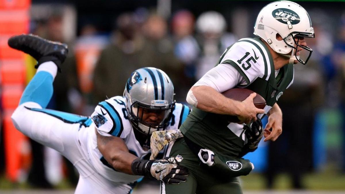 Carolina Panthers defensive end Wes Horton, left, pressures New York Jets quarterback Josh McCown, right, into losing control of the ball during fourth quarter action at MetLife Stadium in East Rutherford, NJ on Sunday, November 26, 2017. The ball was recovered by Panthers linebacker Luke Kuechly, who returned it for a touchdown. The Panthers defeated the Jets 35-27.