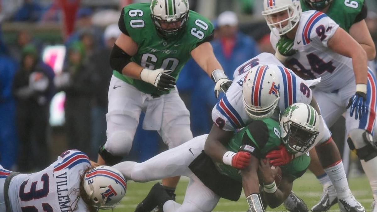 Louisiana Tech defensive tackle Vernon Butler tackles Marshall’s Remi Watson in a 2014 game.