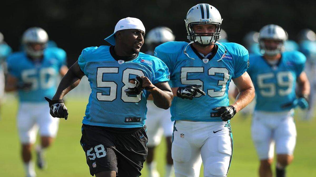 
Carolina Panthers linebacker Thomas Davis jogs with linebacker Ben Jacobs to the next drill station during practice on Monday. Davis got the day off from practice.
