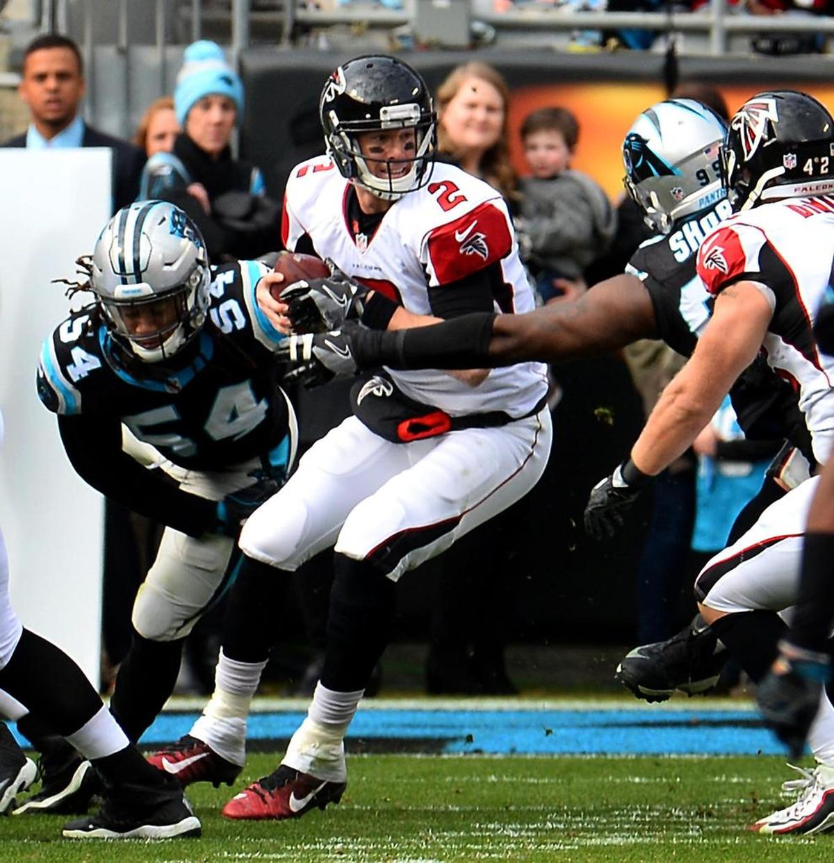 Carolina Panthers defensive tackle Kawann Short, right, and linebacker Shaq Thompson (54) pressure Atlanta Falcons quarterback Matt Ryan in 2016. Both will be chasing him again Sunday.