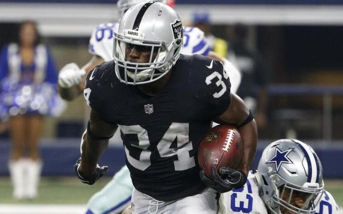The Oakland Raiders signed running back Elijah Hood to their practice squad a day after waiving him.