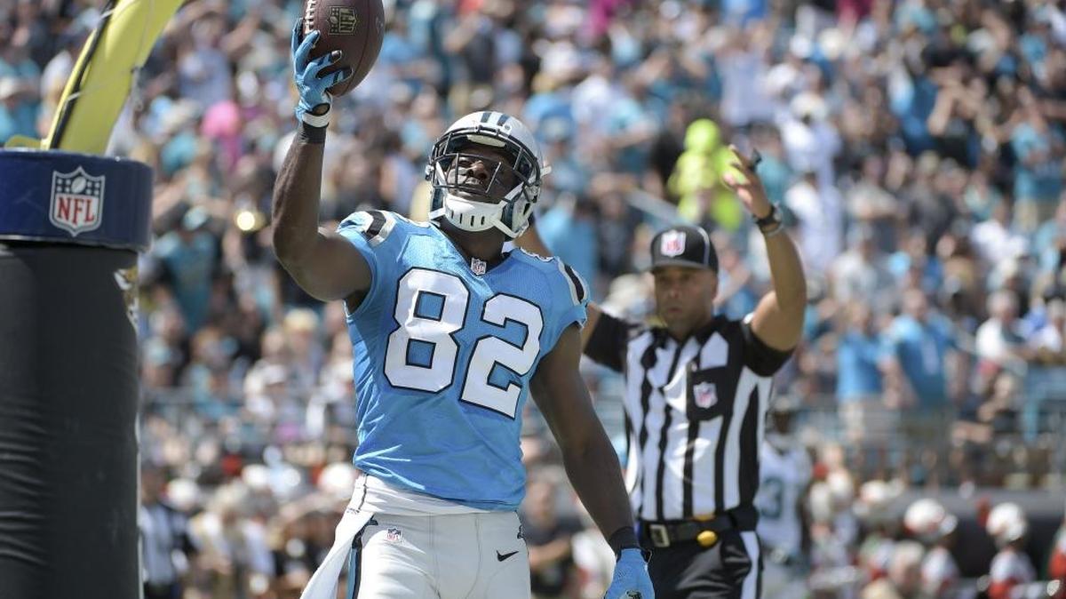 
Carolina Panthers wide receiver Jerricho Cotchery (82) holds up the football in the end zone after scoring a touchdown on a 7-yard pass play against the Jacksonville Jaguars during the first half of an NFL football game in Jacksonville, Fla., Sunday, Sept. 13, 2015.
